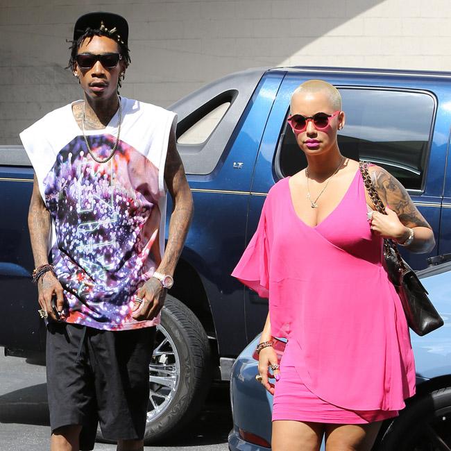 Wiz Khalifa and Amber Rose celebrate divorce settlement at strip club